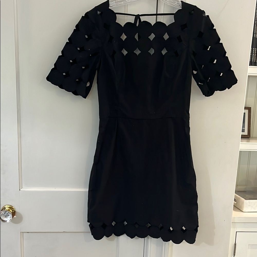 Anthropologie Elegant Black Dress with cut outs at hem and sleeve
Worn once.